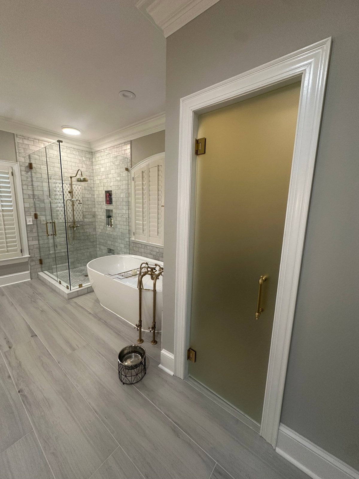 Bathroom glass installation showing the shower enclosure and frosted door